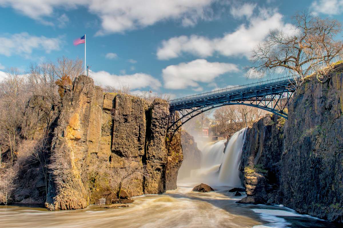 water bridge over river near waterfall paterson